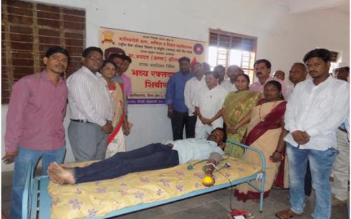 A volunteer donating blood on the occasion of   Birthday of Hon. Jaydattaji (Anna)