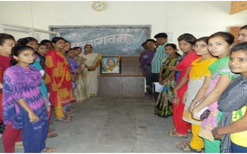 Principal  Dr.Deshmane P.B. celebrating World Women’s Day with college girl students